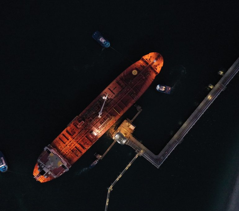 Aerial view jetty with ship at night